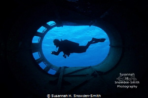 “Smokestack Silhouette” - A diver is framed within the sm... by Susannah H. Snowden-Smith 